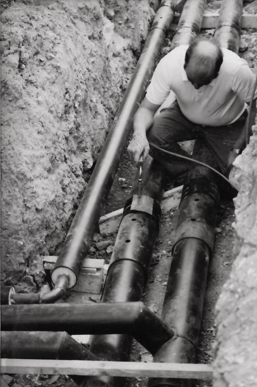 Historic installation of Hiline pipe system black and white photo